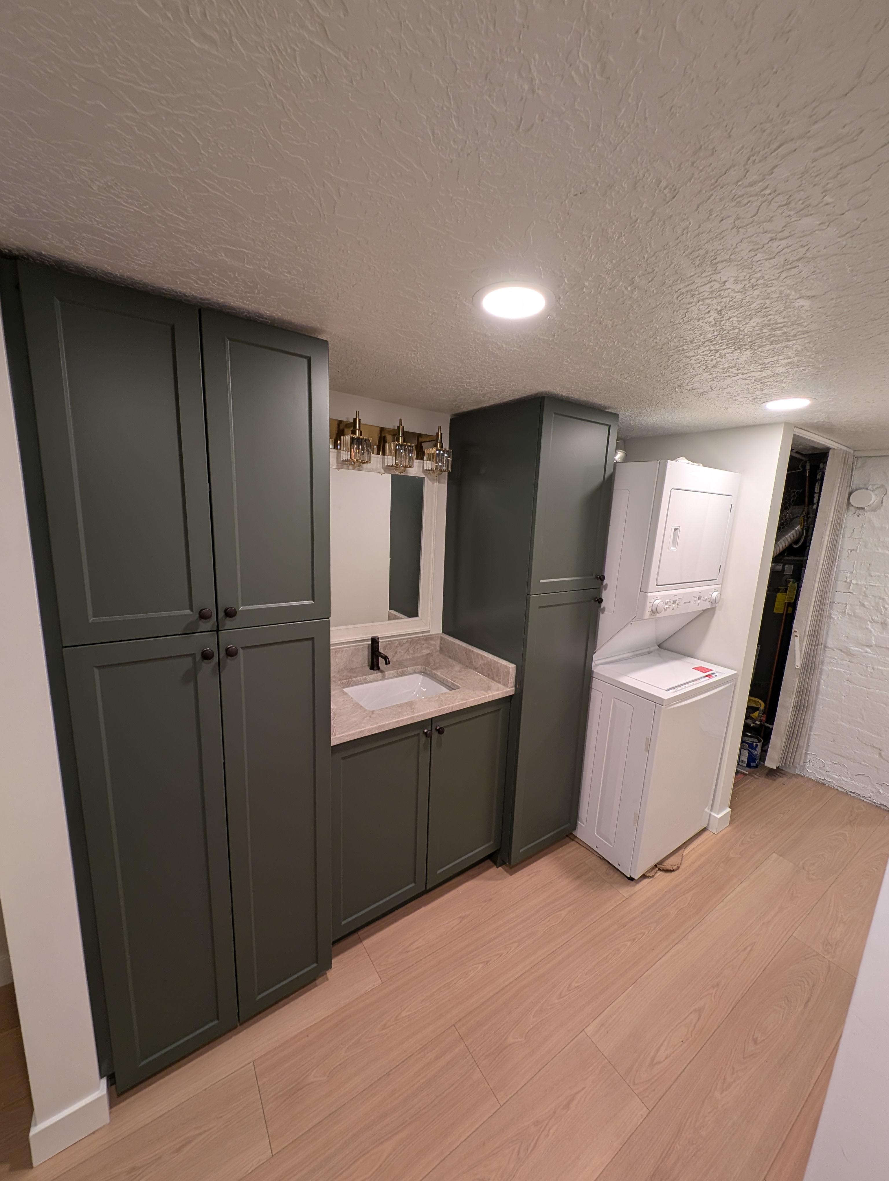 Addition remodel with a bathroom sink and laundry area